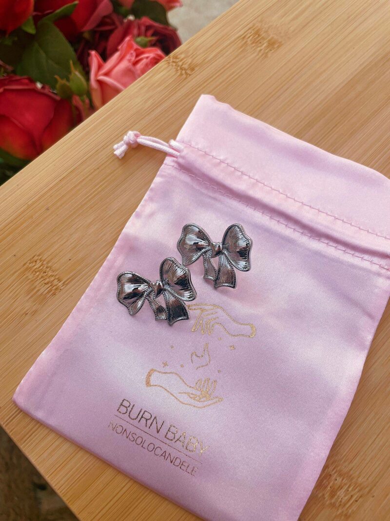 Orecchini fiocco color argento glitterato